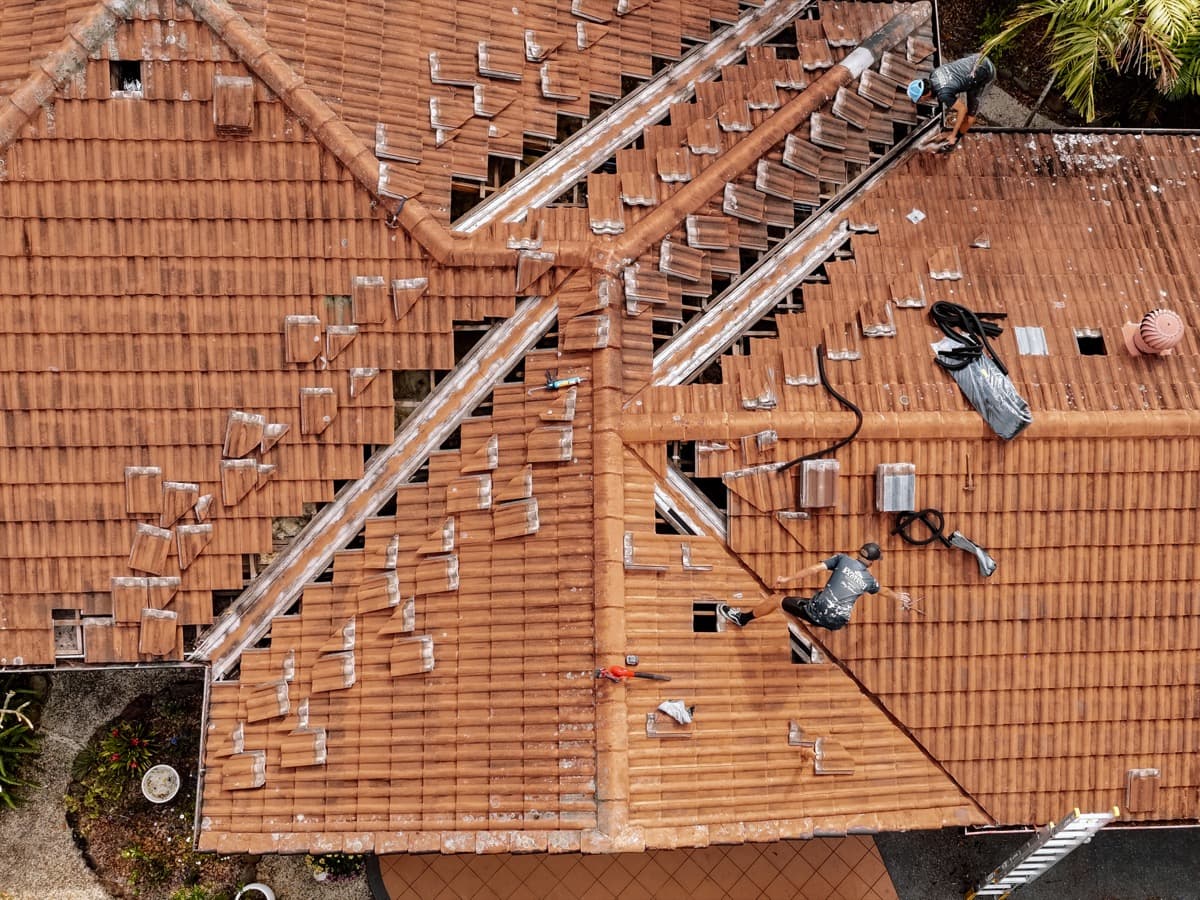 Roof repair work in progress - terracotta tile repointing